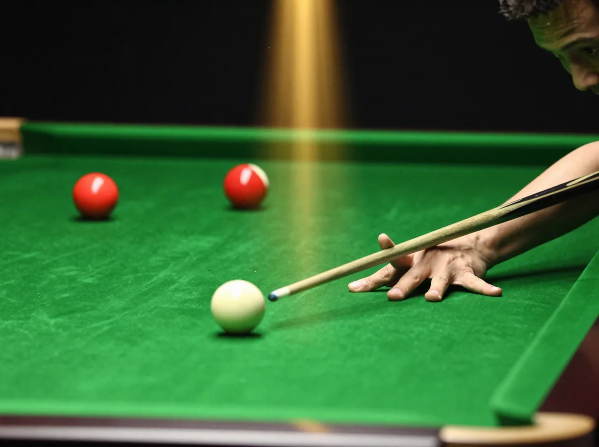 Close-up of a cue striking the white ball